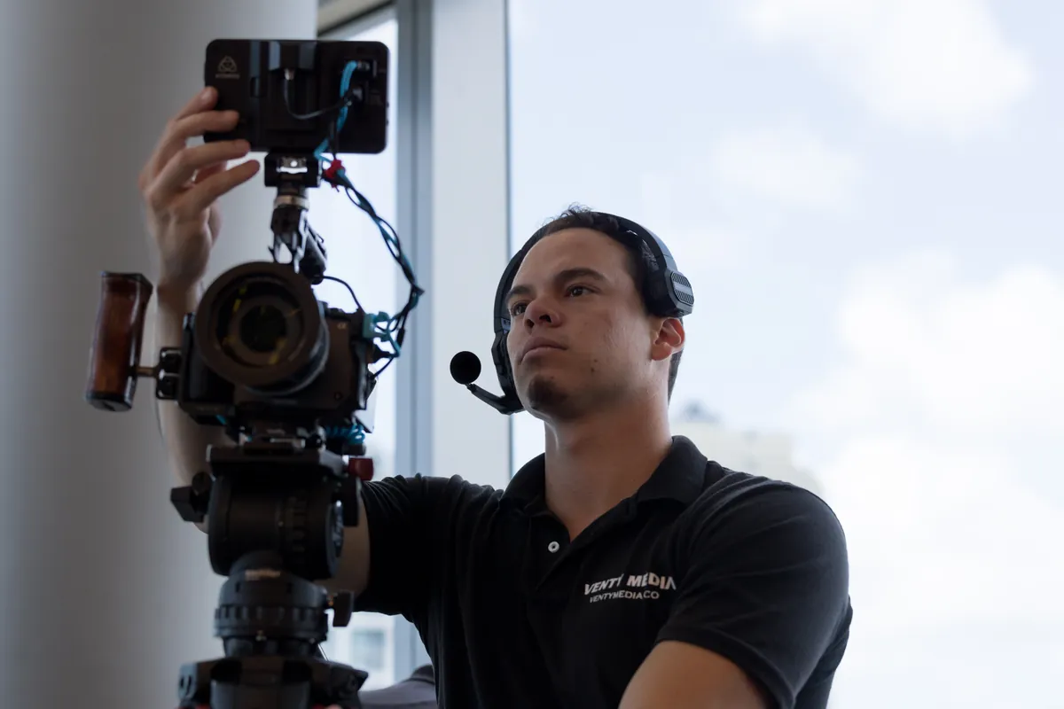 Venty Media crew member operating camera on set